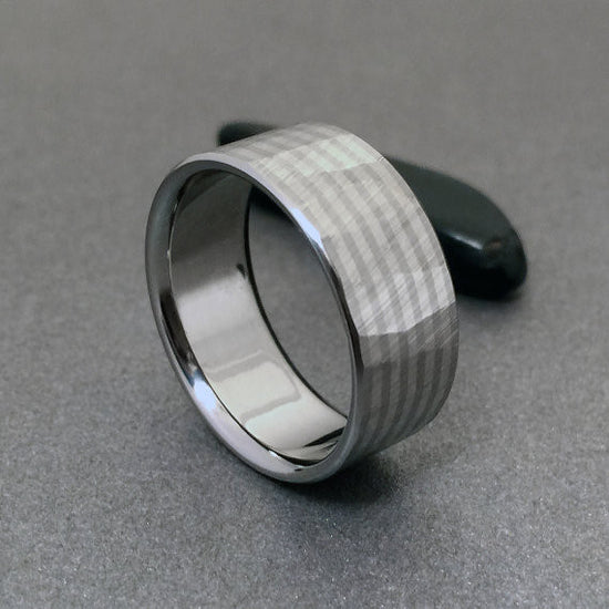 Handcrafted titanium band, inlaid with four stripes of solid 18k white gold. Faceted with our original "Wood Grain Sequoia" finish.