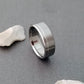 Titanium Wedding Ring with a Solid Off-Center Platinum Inlay in a Flat Profile